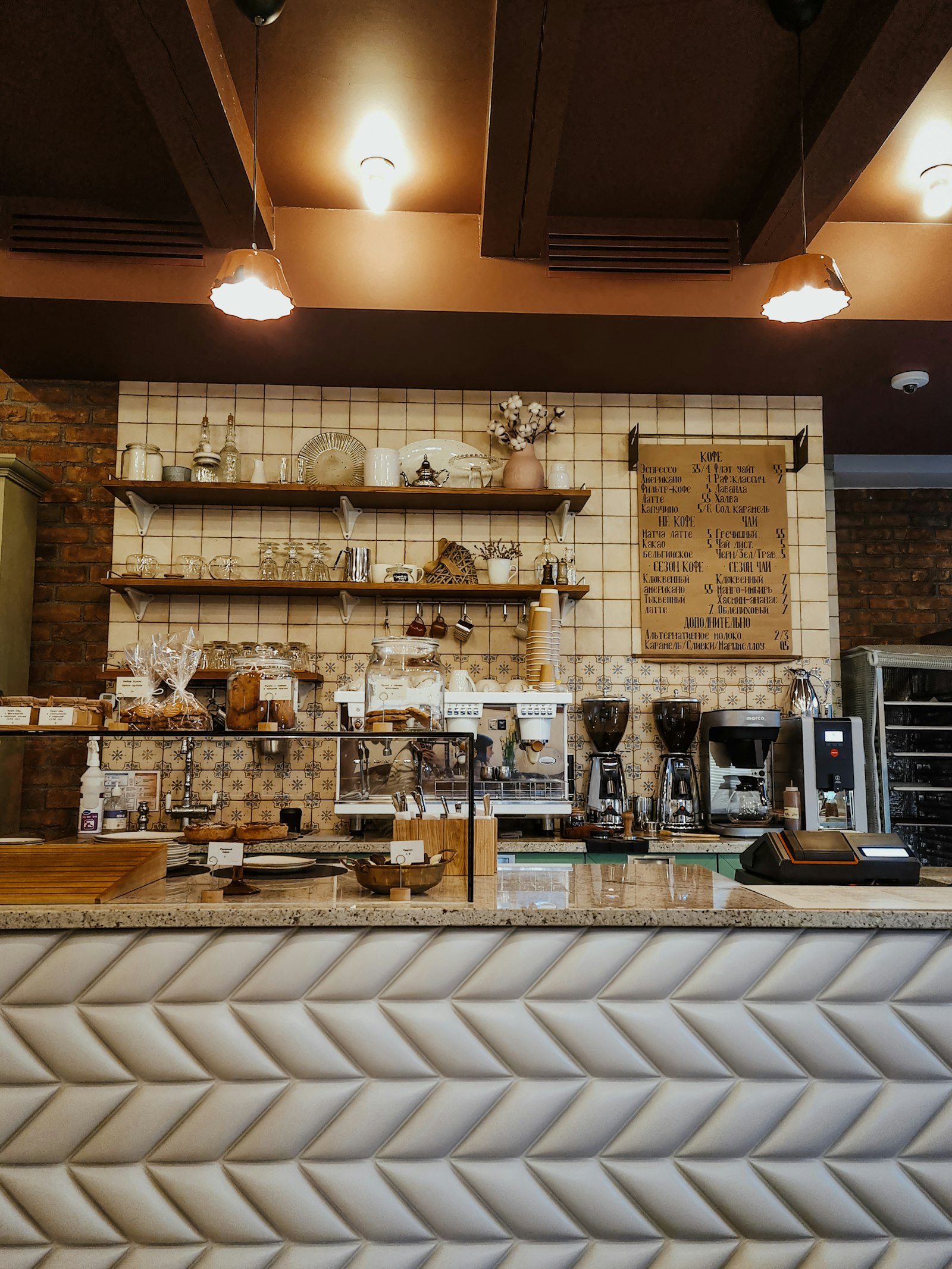 The shop's back counter with bottles, clippers and tools lined up on the shelves